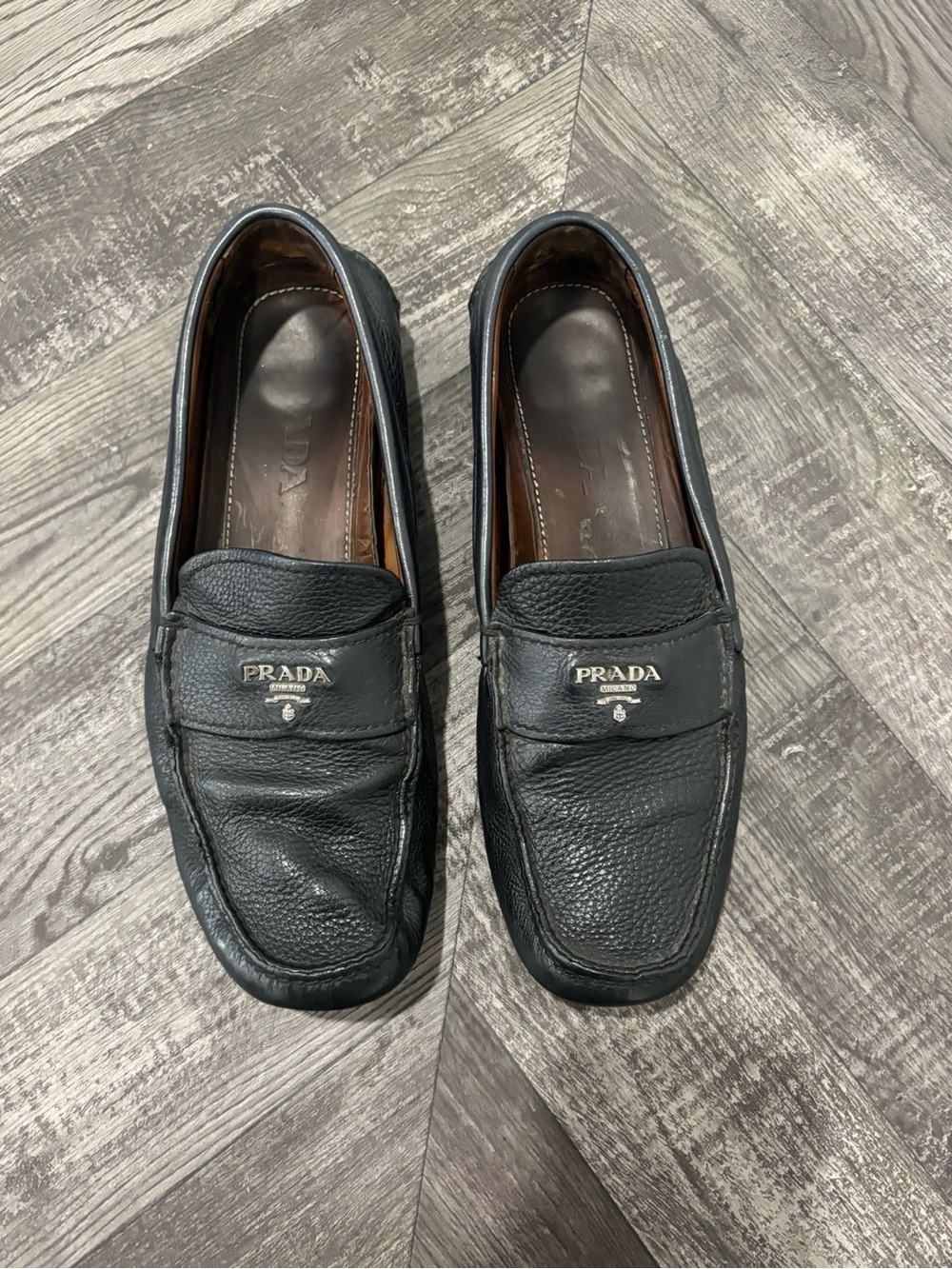 Prada navy Pebbled Leather Penny Loafers with Silver Logo